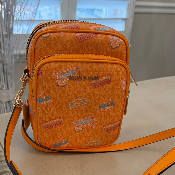 Michael Kors Handbags - Michael Kors Jet Set Travel Vibrant Orange Graphic Crossbody Bag